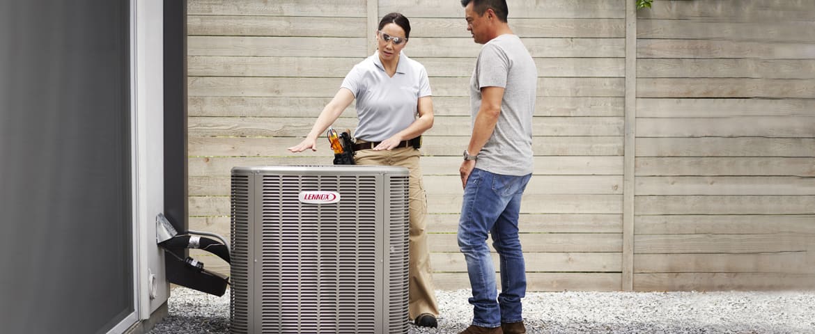 A Lennox dealer inspecting unit